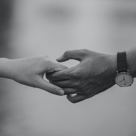 Two people holding hands.